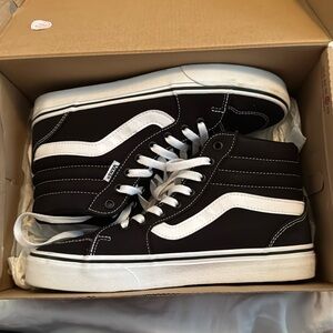 Black and white high top vans